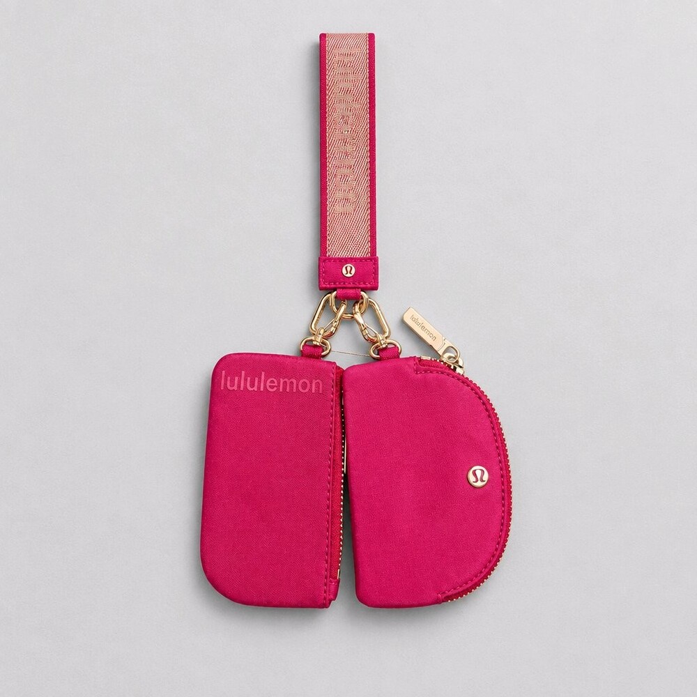 lululemon Dark Pink Wristlet with Dual Zippered Pouches and Gold-Tone Hardware